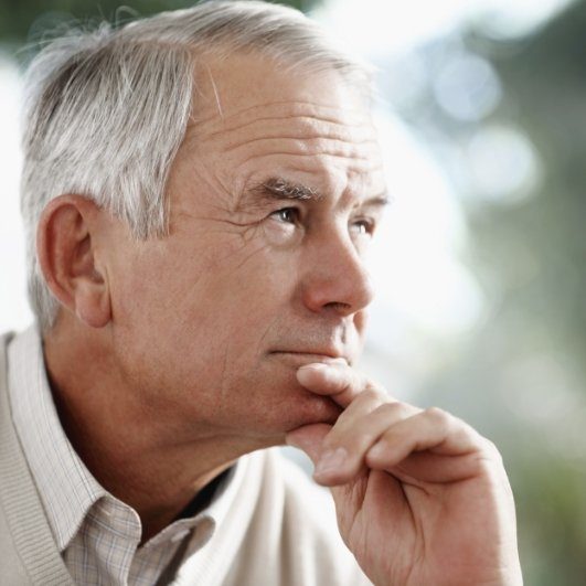 senior gentleman contemplating dental implants