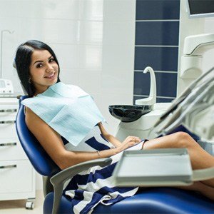 Dental patient smiling after treatment with nitrous oxide