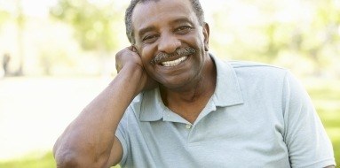 Man smiling after dental implant tooth replacement