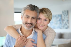 portrait of a couple smiling at home