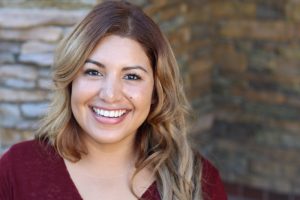 woman smiling on front porch