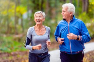 older couple running outdoors