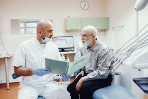 Male patient asking questions about dental implant surgery