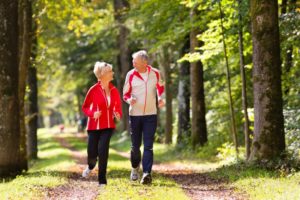 Senior couple enjoying long life expectancy with dental implants