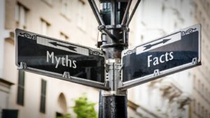 Street sign pointing different directions for facts and dental sedation myths