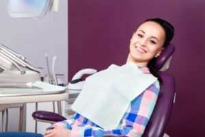 Happy, relaxed dental patient reclining in treatment chair