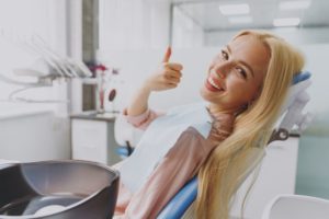 Happy patient giving thumbs up for dental sedation