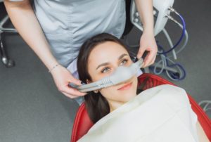 Female dental patient wearing nitrous oxide mask