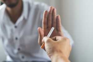 Man refusing the offer of a cigarette