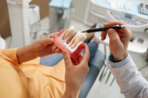 Dentist and patient talking about dental implants